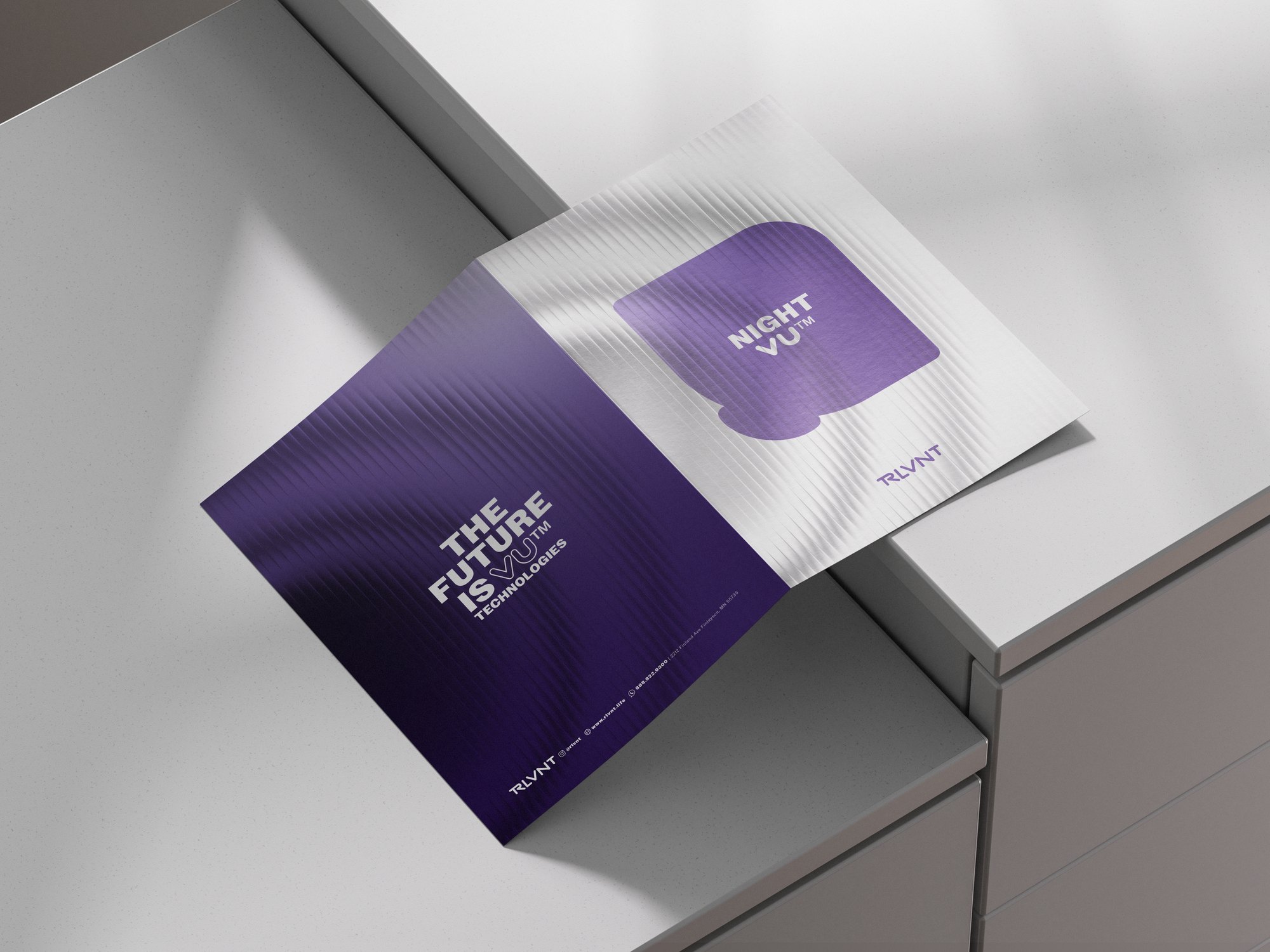 RLVNT NightVU branding — folded brochure reverse mockup