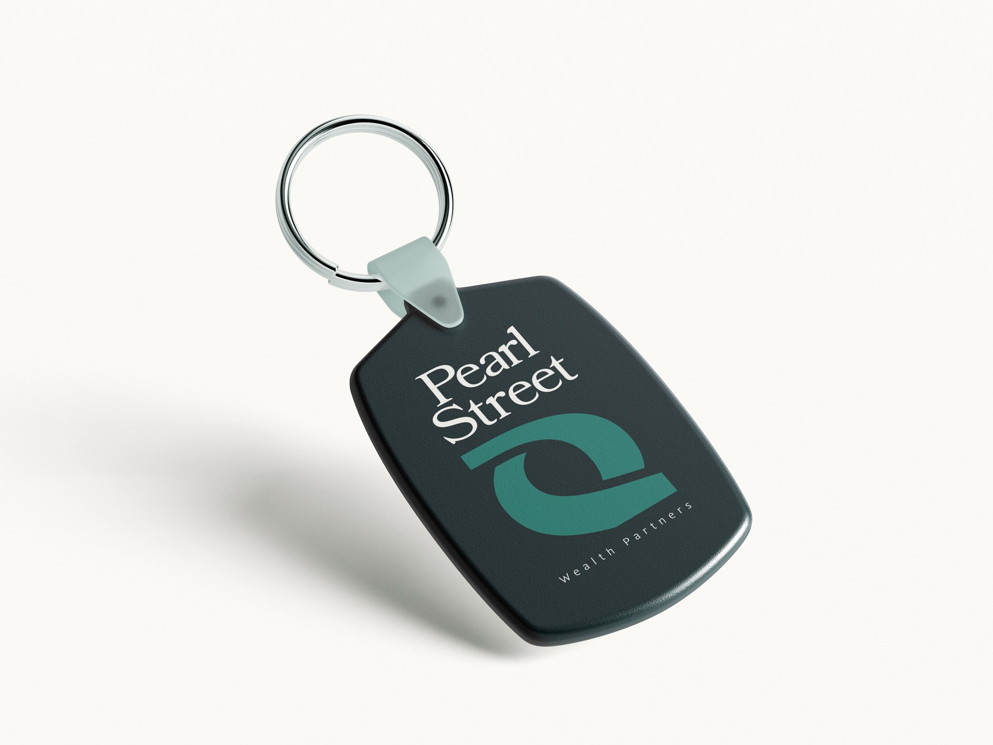 Pearl Street Wealth Partners branding — plastic keychain mockup