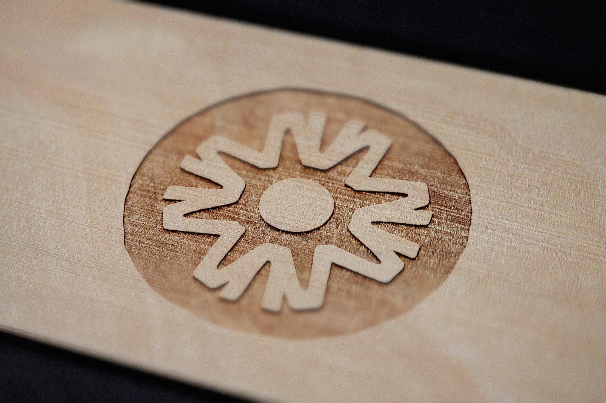 Agile Healing Arts symbol engraved in wood