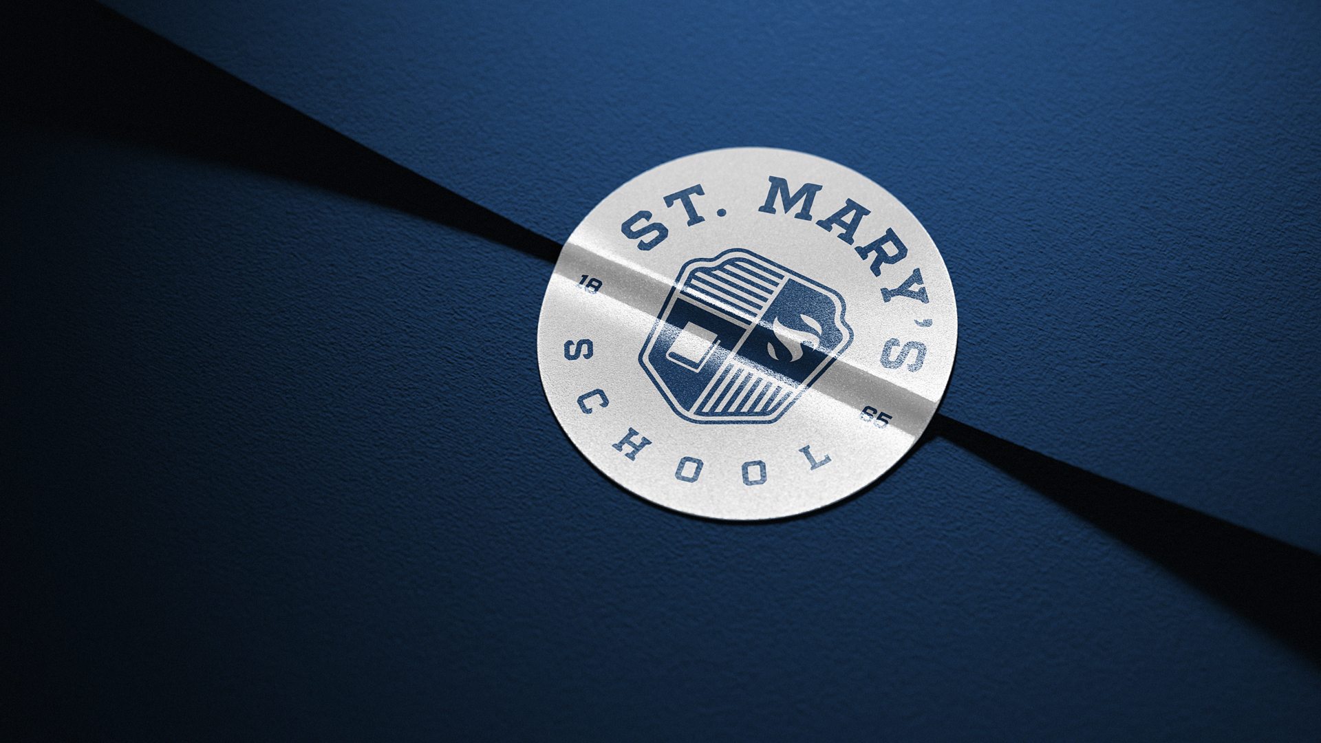 St. Mary’s school branding exercise — School seal on navy background