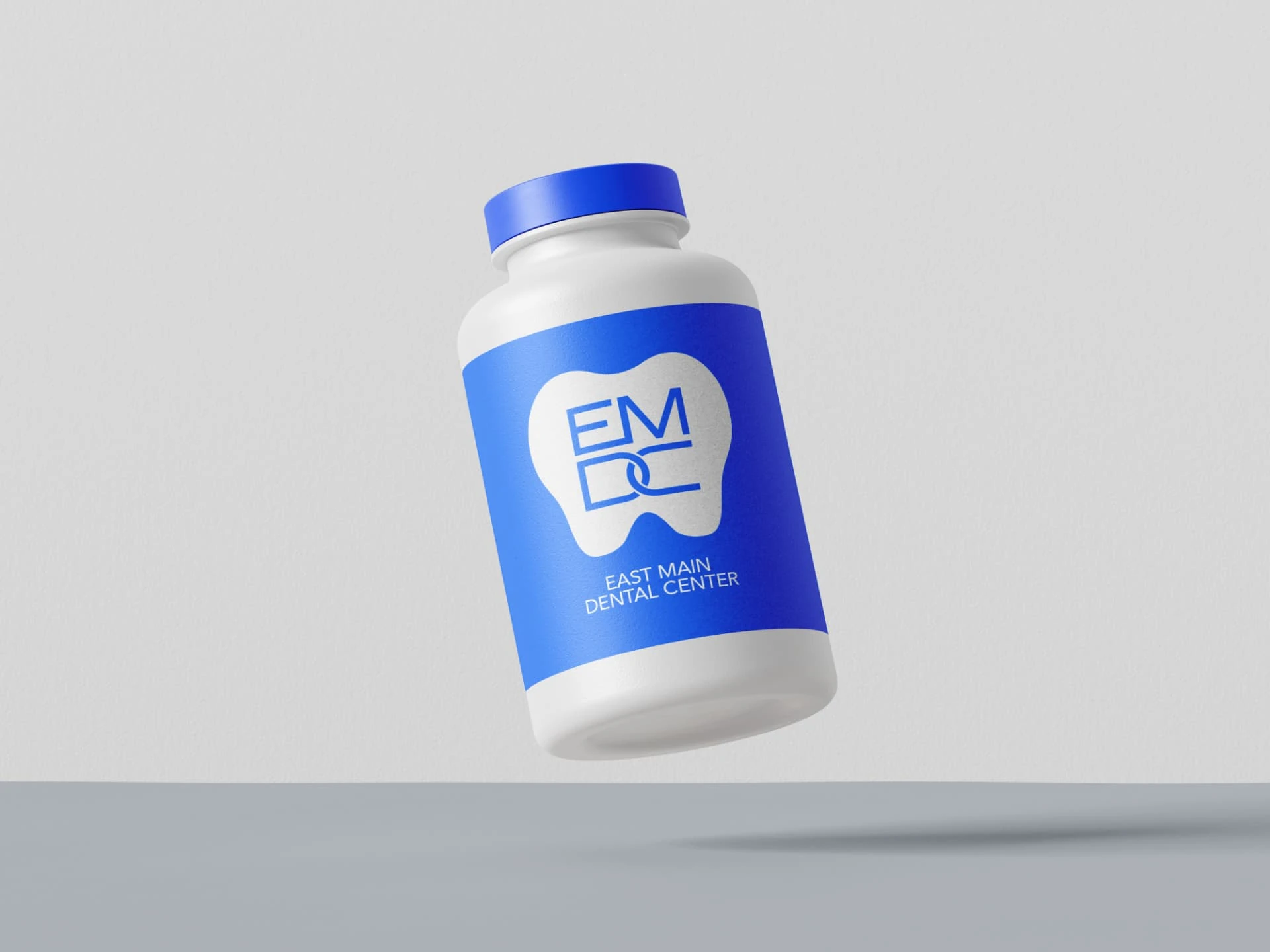 East Main Dental Center branding — patient product jar mockup with EMDC label