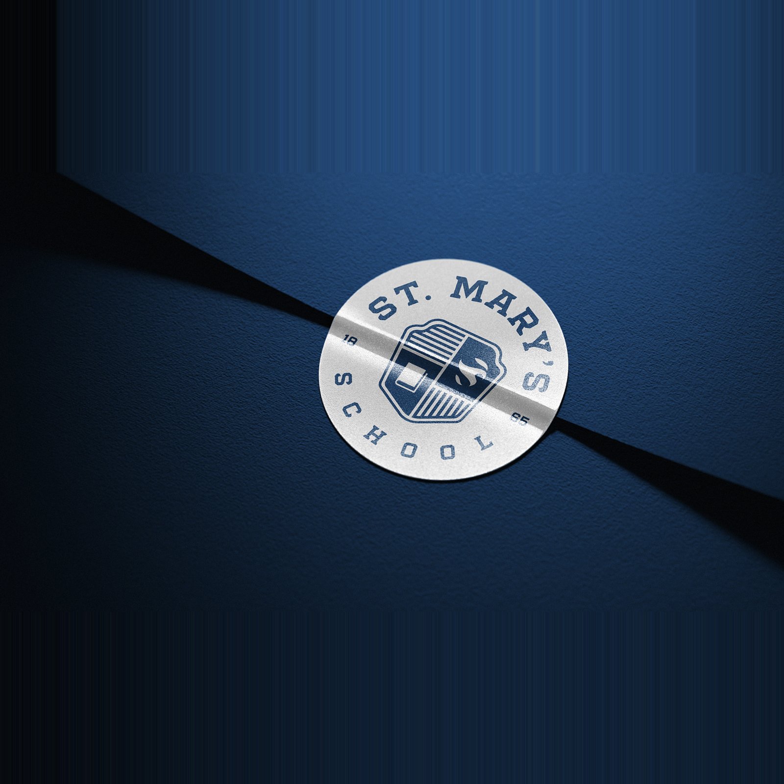 St. Mary’s School seal and Crusader-inspired monogram in a school branding concept by Solve + Create