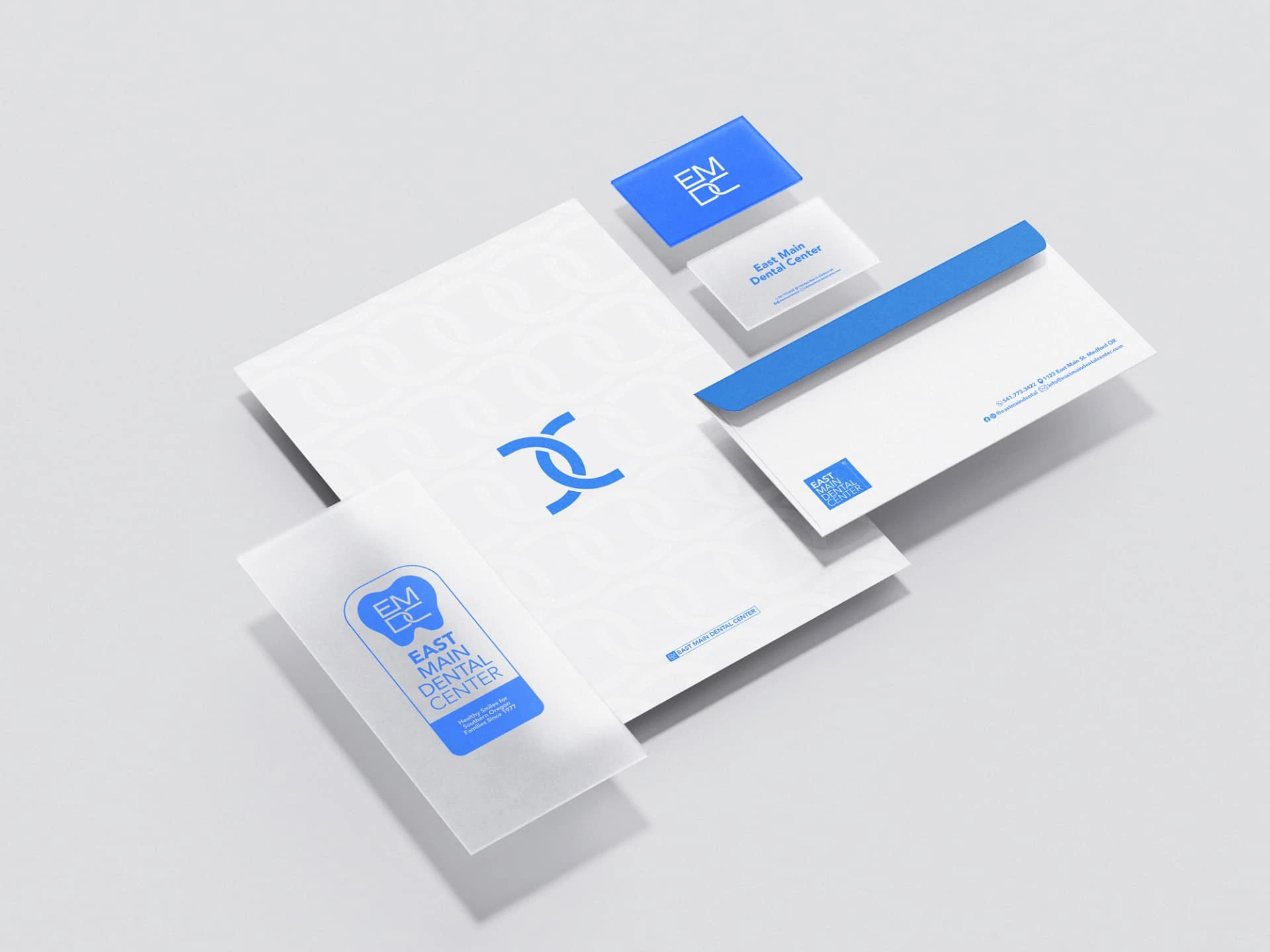 East Main Dental Center brand identity — stationery and business card mockups
