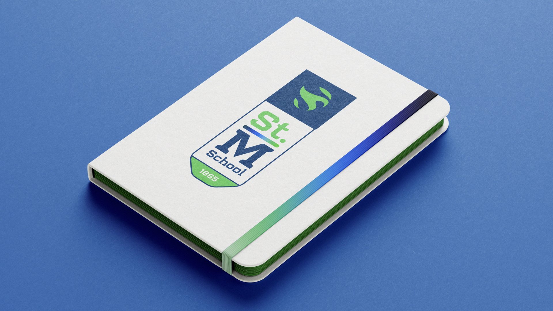 St. Mary’s school branding exercise — Notebook with stacked school lettermarks