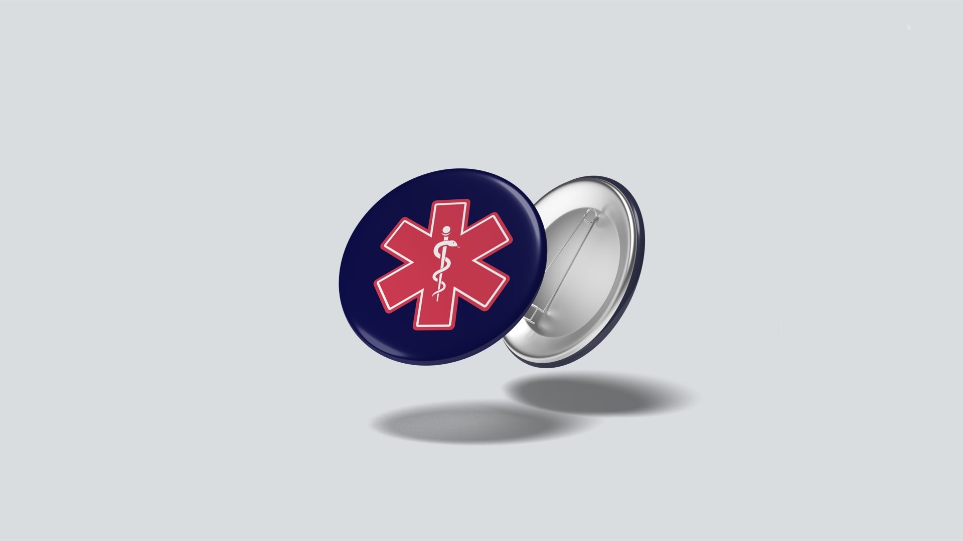 First Response navy button pin with the red Star of Life emblem.